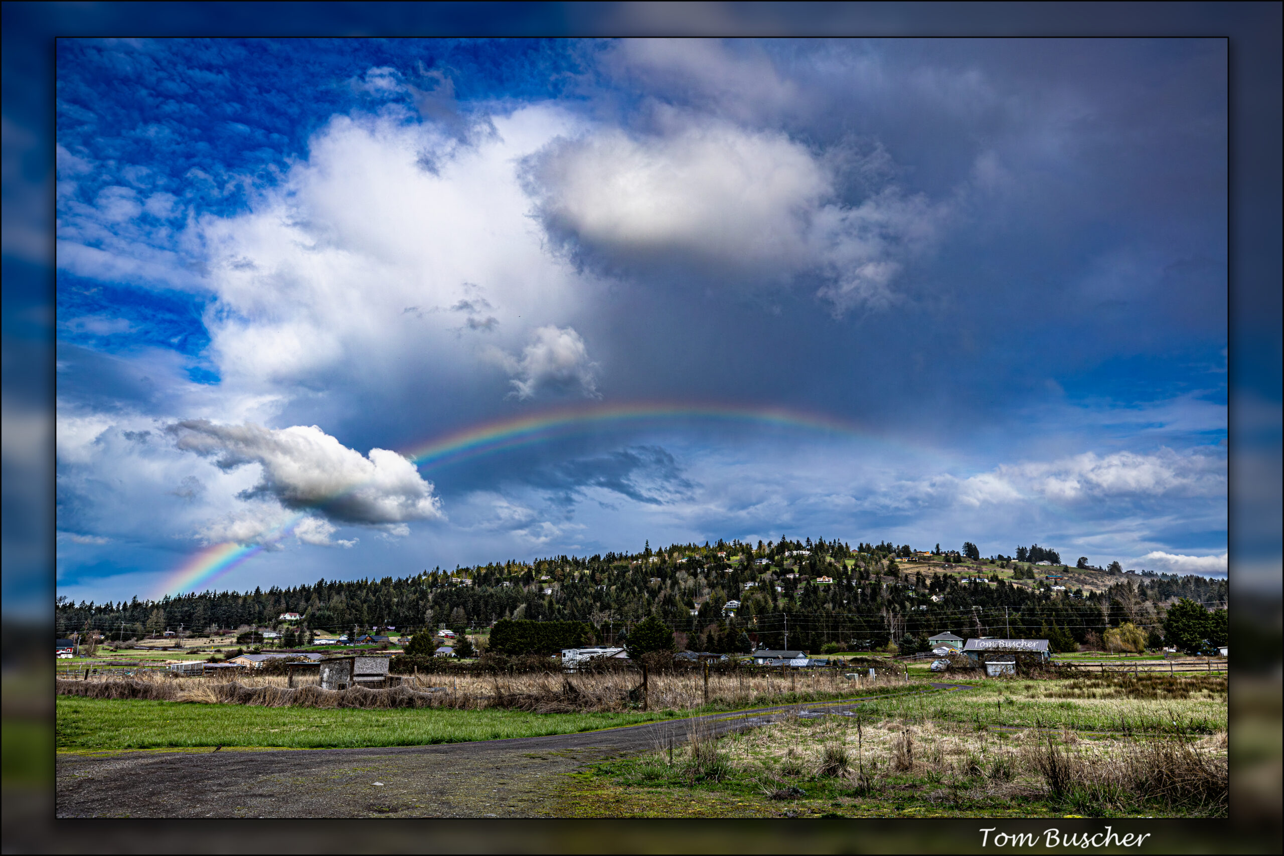 Rainbow between 3D clouds over Bell Hill in Sequim, Washington